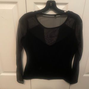 Black top with mesh sleeves and neckline.